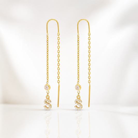 Gold-tone chain dangle earrings with a CZ-accented initial charm.