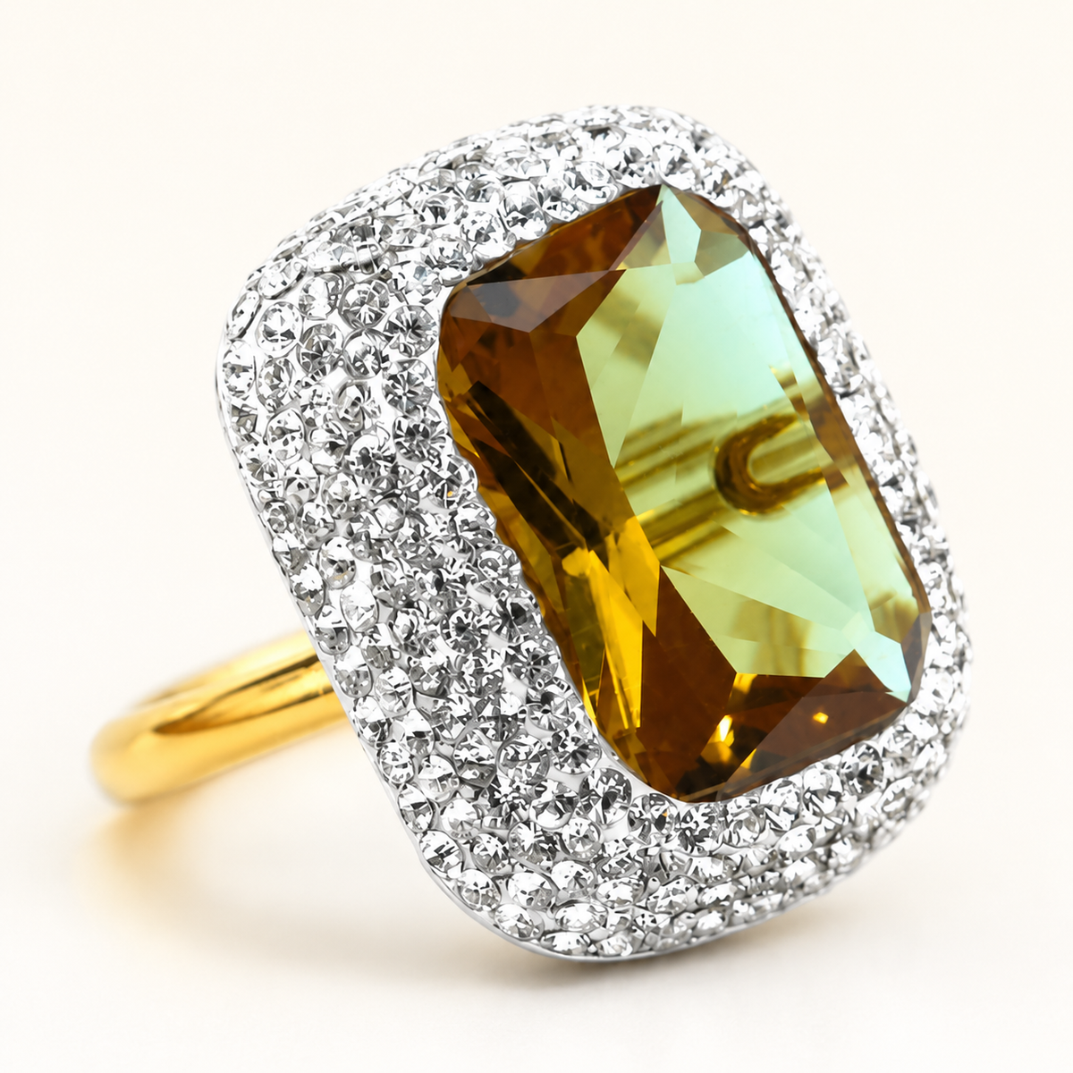Close view of a rectangular faceted stone surrounded by a CZ halo.