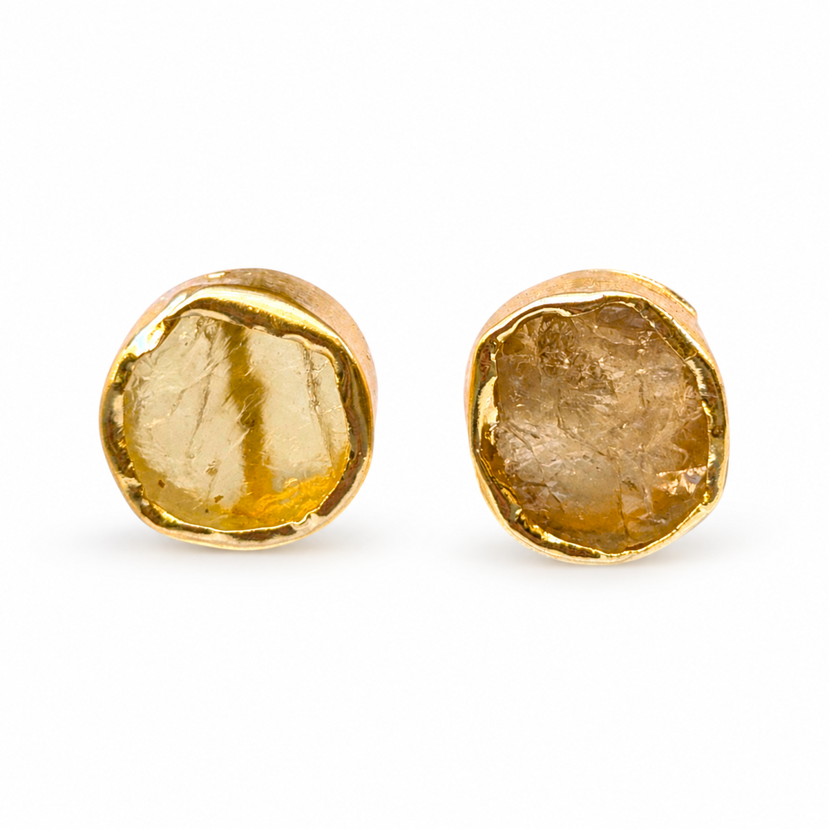 Pair of rough citrine stud earrings with a handmade gold setting.