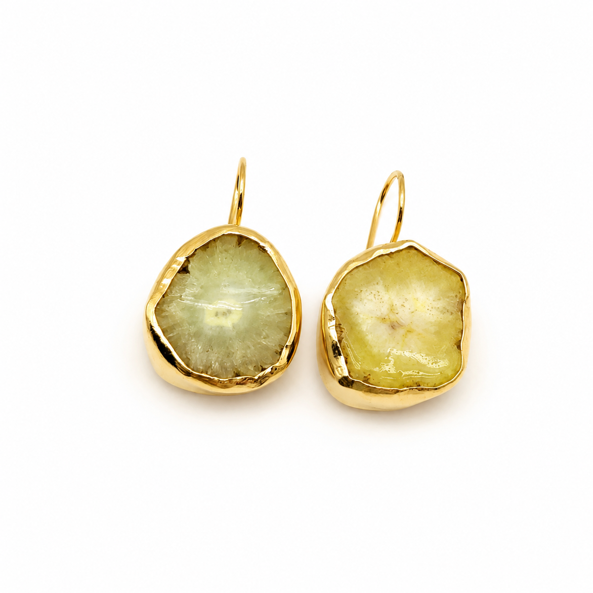 Raw garnet hoop earrings with a gold-plated finish and organic shape.