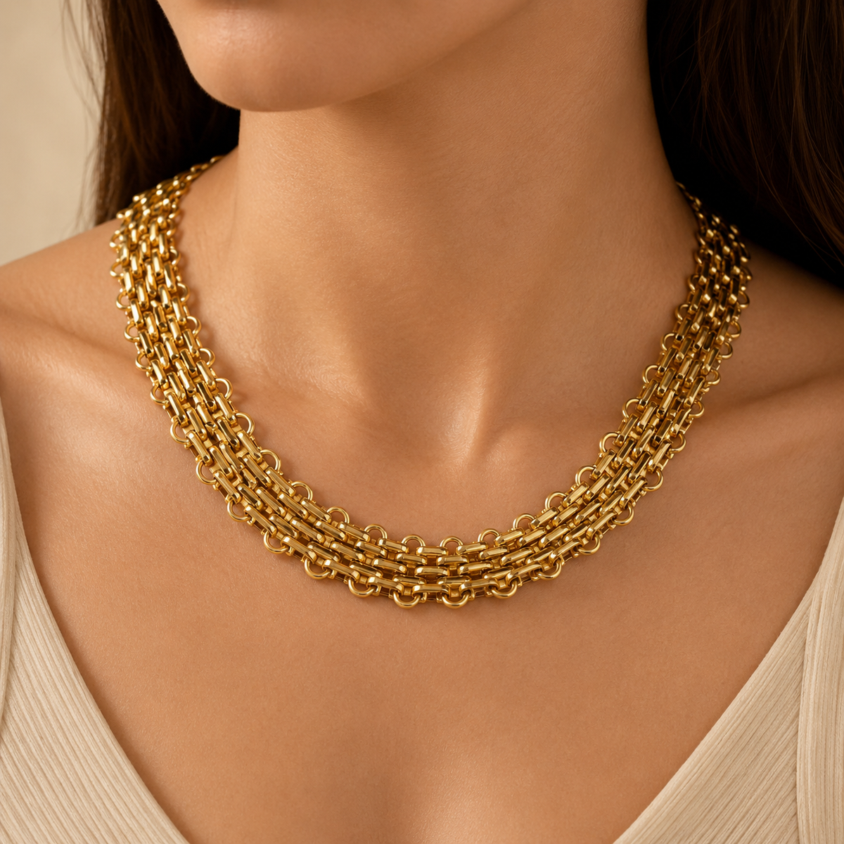 Flat chain statement necklace in gold-plated brass shown from above.