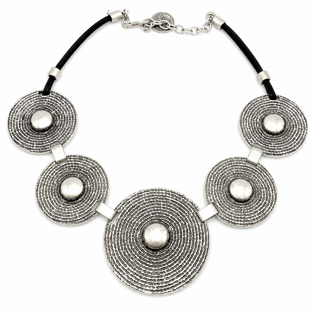 Concentric disc statement necklace with textured silver-tone discs and a black cord.