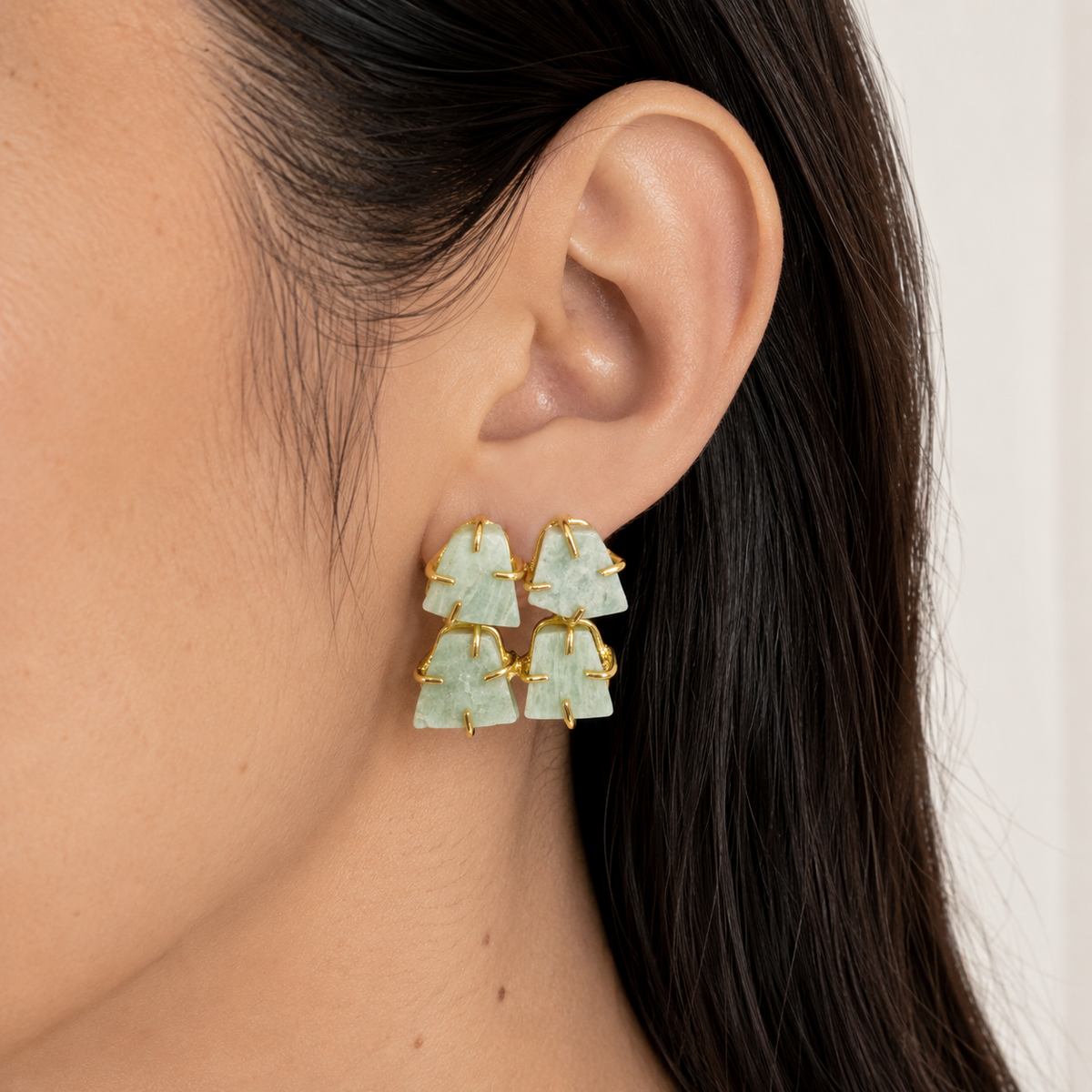Rough apatite stud earrings in a gold-plated setting, shown from the front.