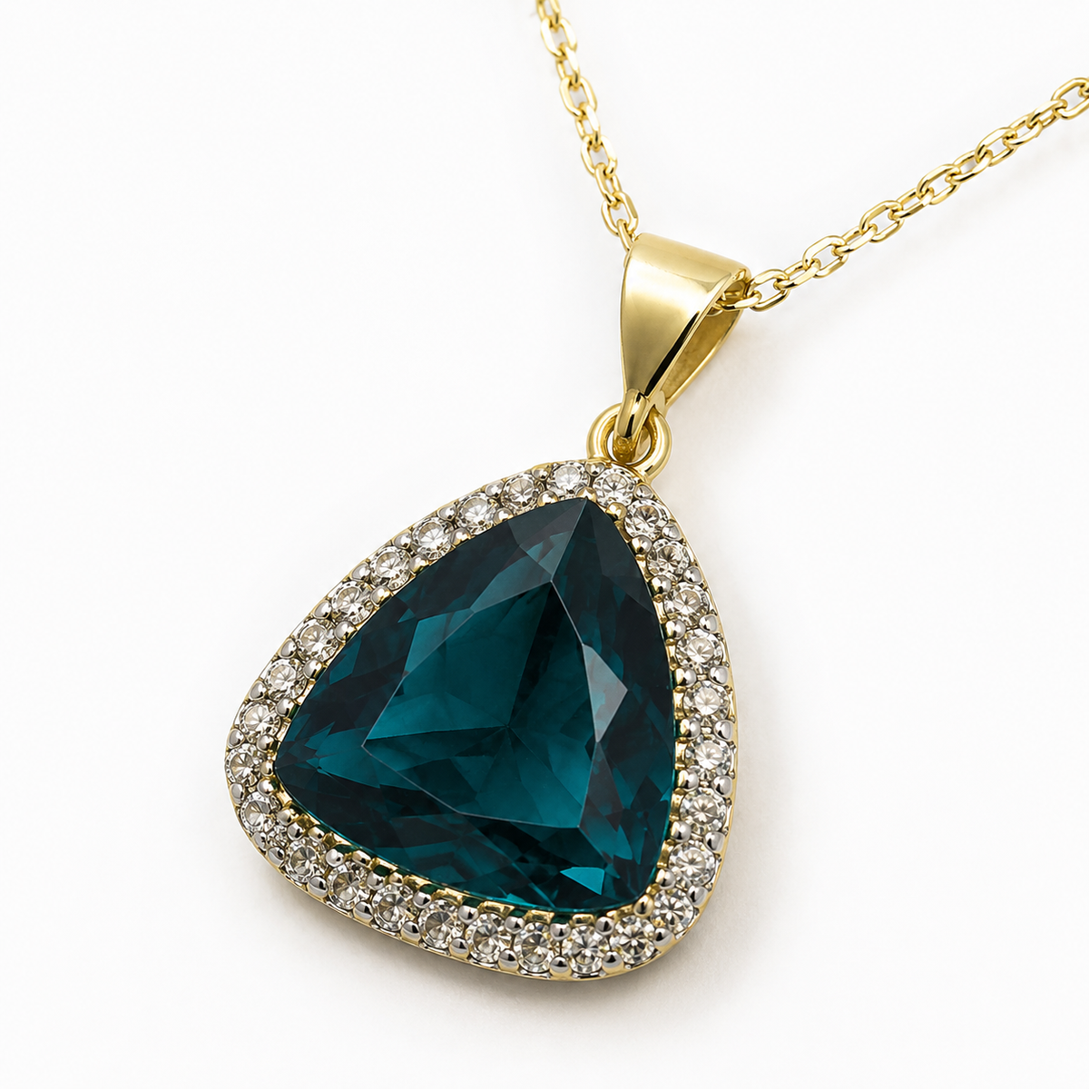 Close-up of a green triangle pendant with a gold-tone frame.