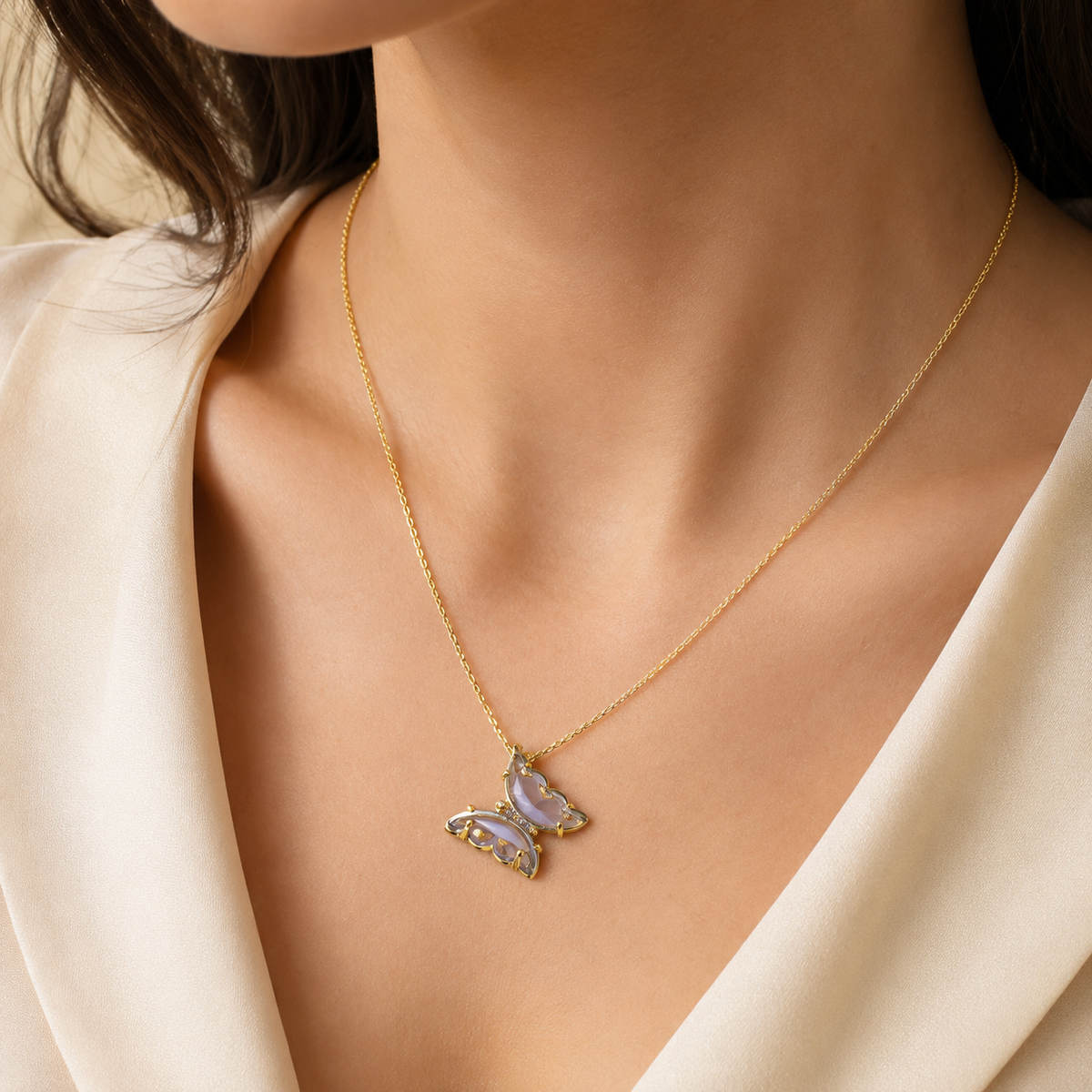 Purple butterfly pendant necklace shown on a white background