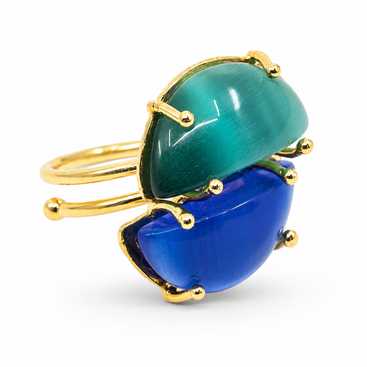 Gold-plated adjustable ring with two cat-eye style stones in blue and teal.