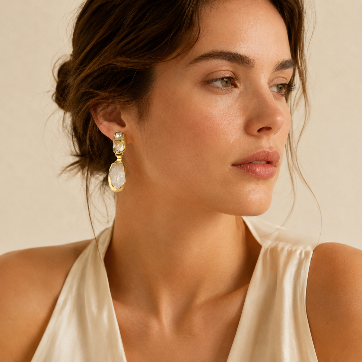 Gold-plated drop earrings with round pearl accents in a refined style.
