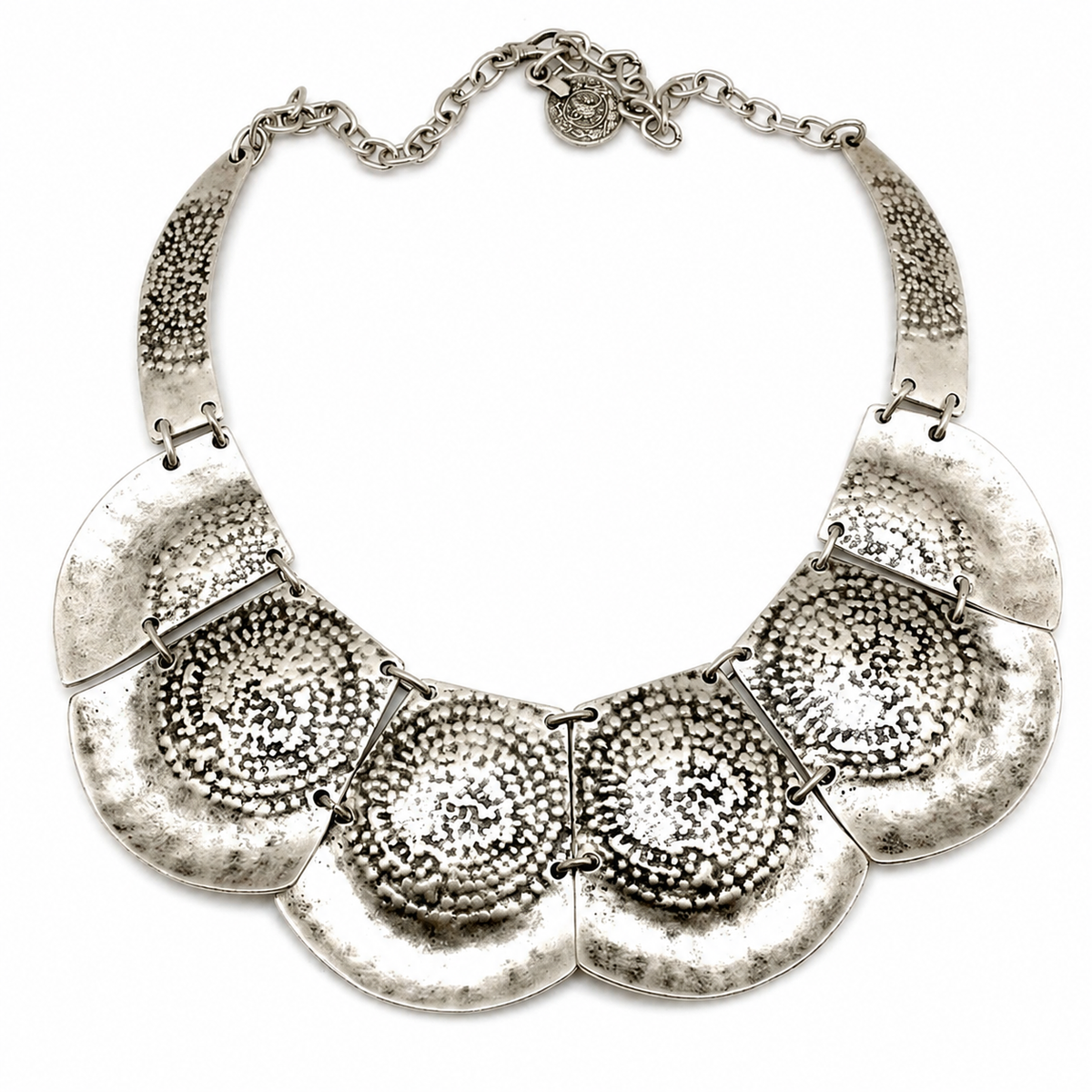 Silver hammered plate statement necklace with a textured sculptural design.