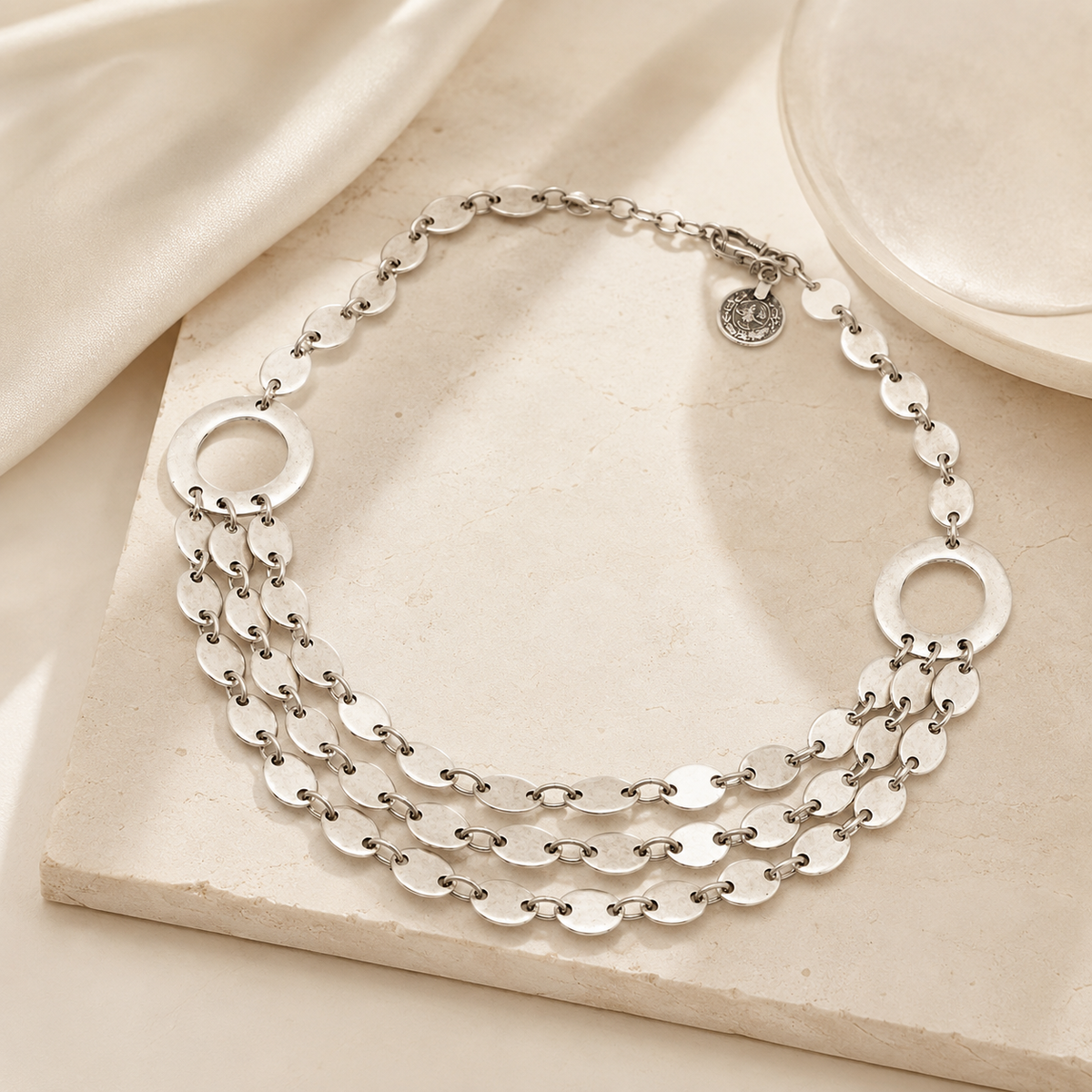 Layered oval link necklace with a modern silver-tone look.