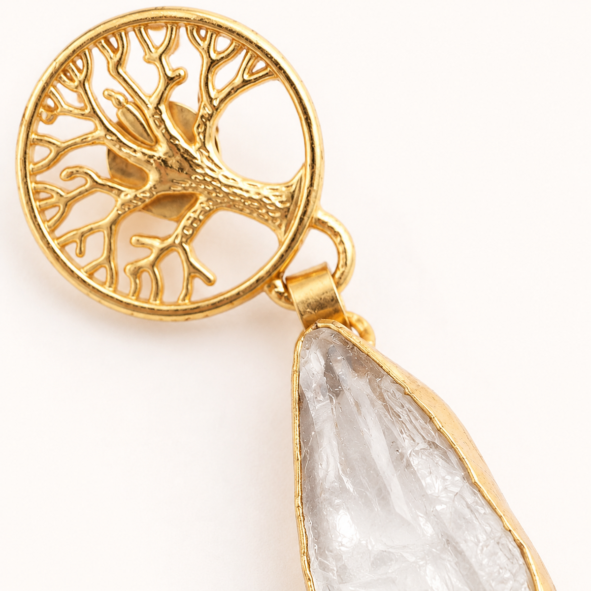 Close view of the tree of life detail and clear stone drop.