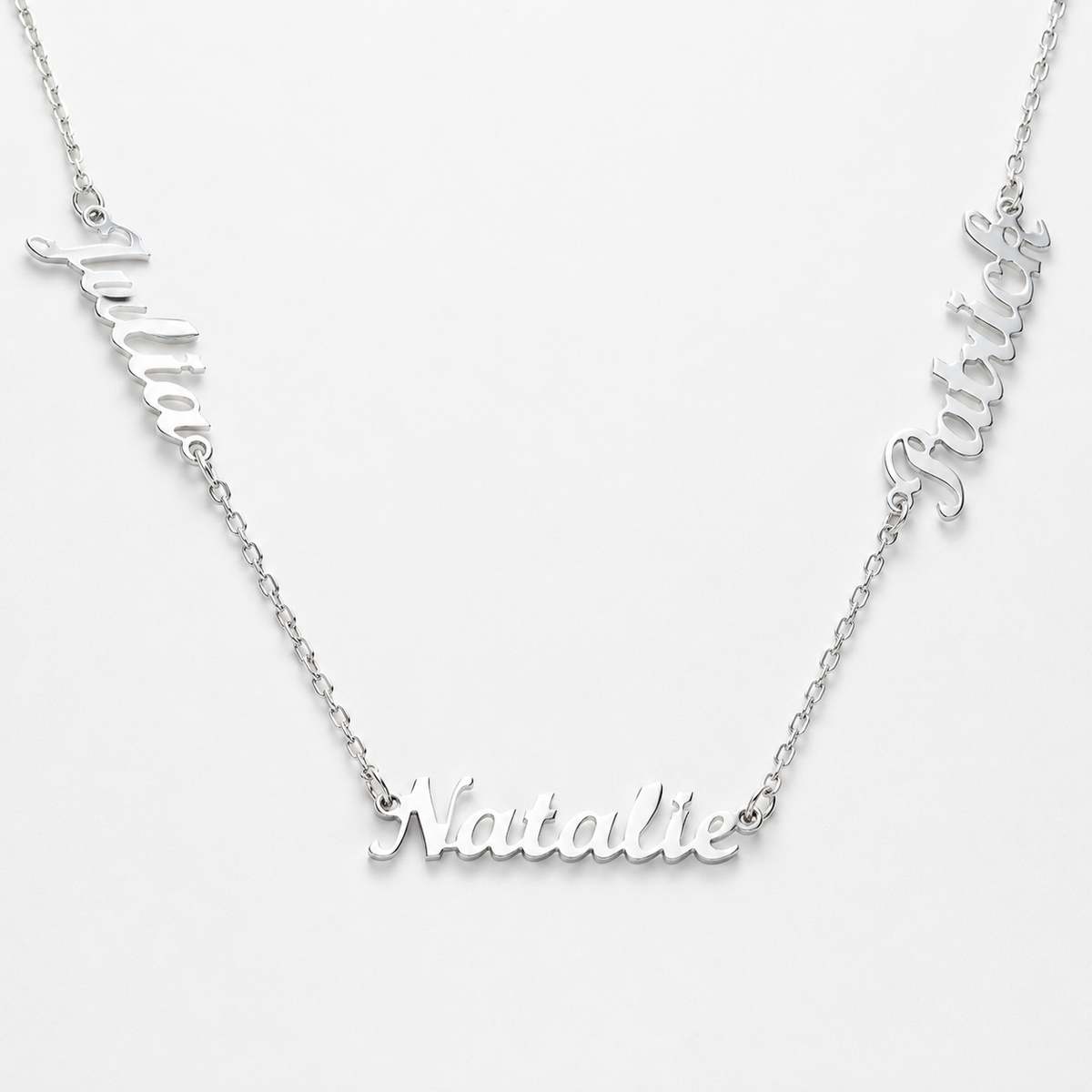 Close view of the engraved name charms and polished silver-tone finish.