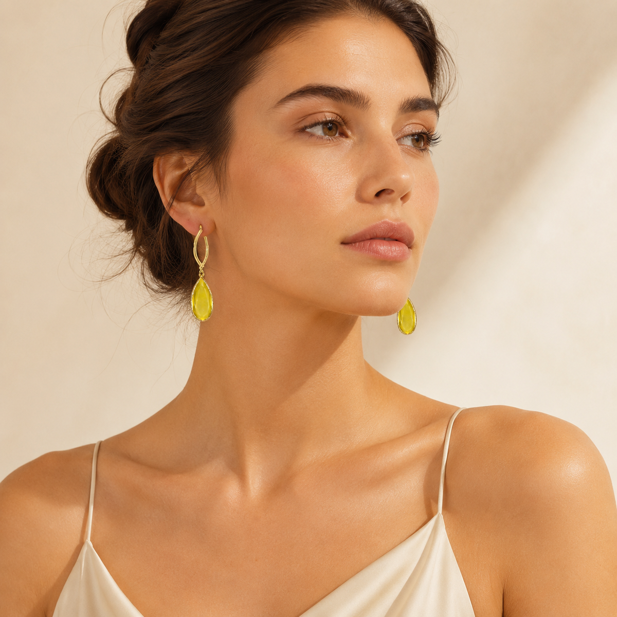 Pair of mustard drop earrings with a polished gold finish.