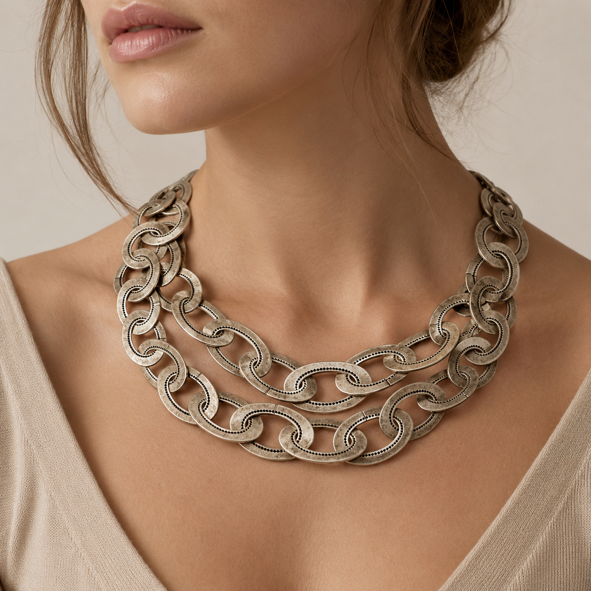 Oversized silver-tone chain link necklace shown from the front.