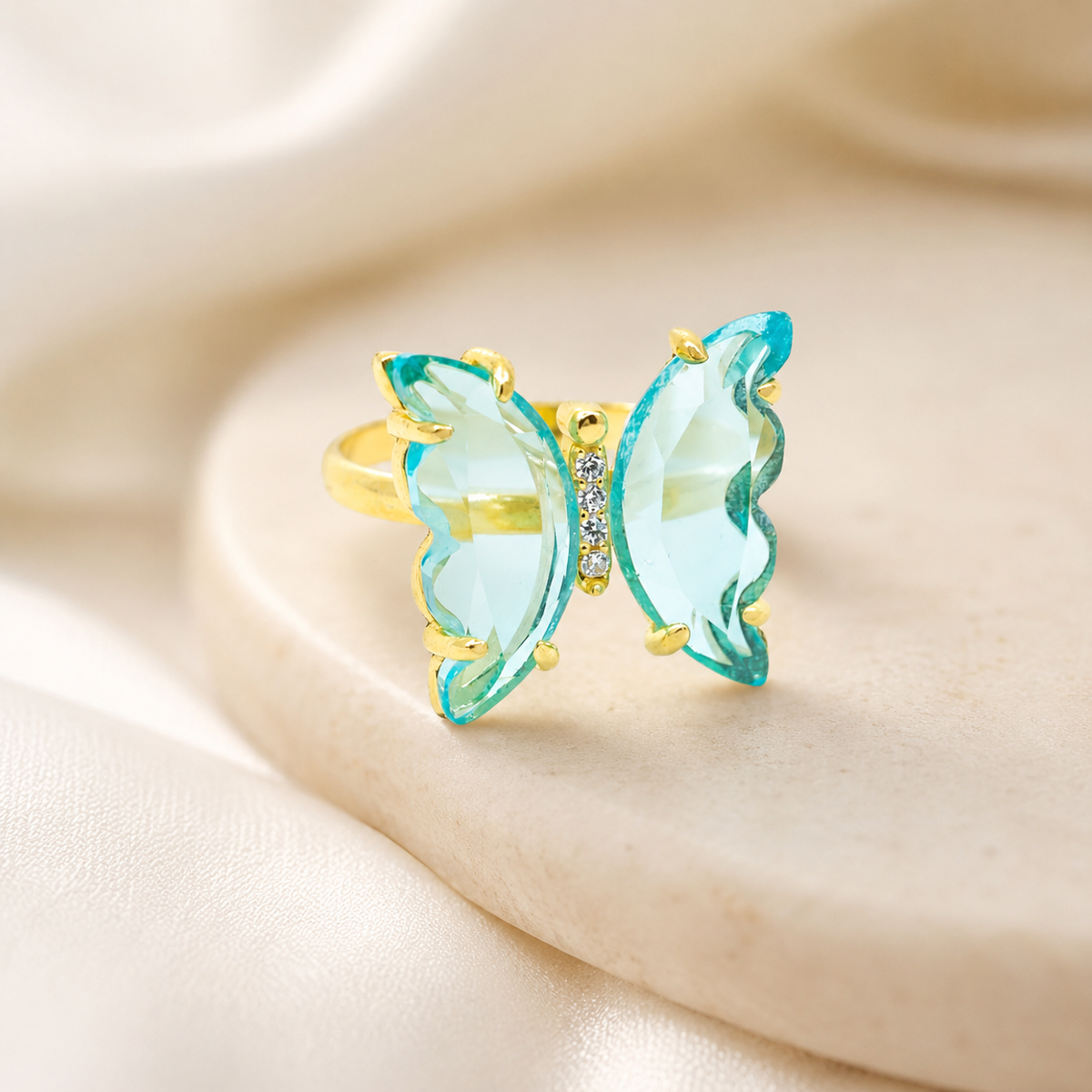 Butterfly ring in gold-plated sterling silver with sky blue topaz wings.
