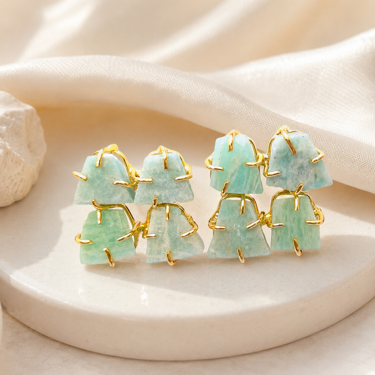 Gold-plated rough apatite stud earrings with a sculptural blue-green look.