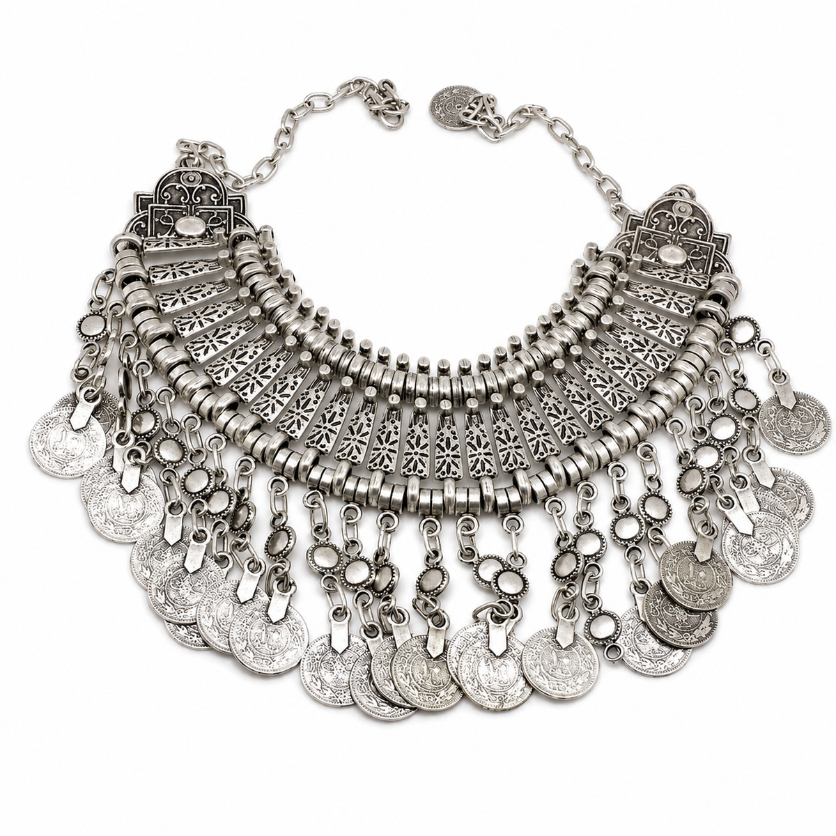 Silver-tone boho bib necklace with layered coin fringe and detailed metalwork.