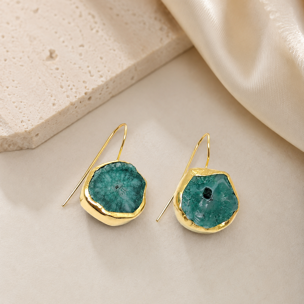 Gold-plated drop earrings with brown druzy mother of pearl centers in a soft organic silhouette.