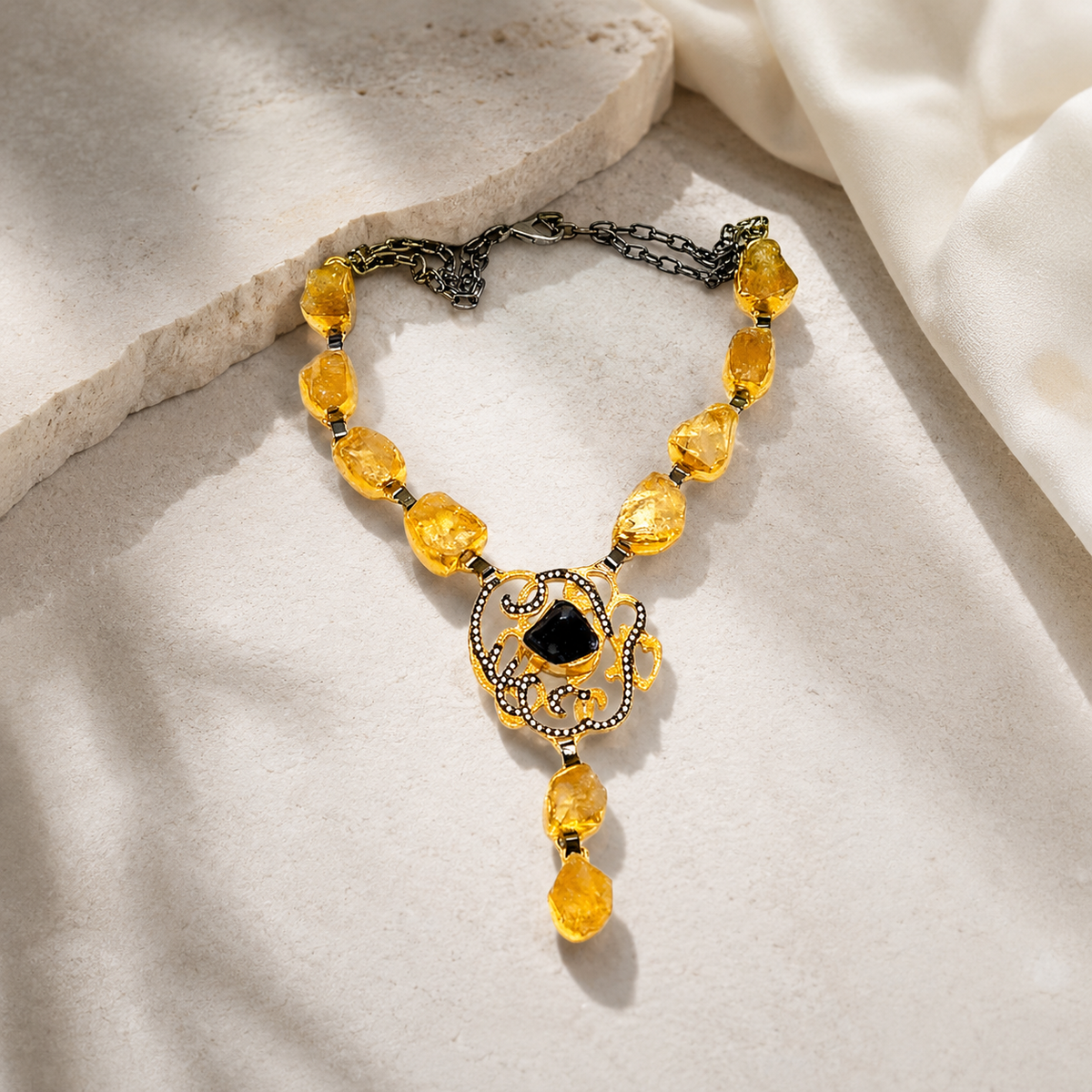 Citrine medallion drop necklace with a bold pendant silhouette.