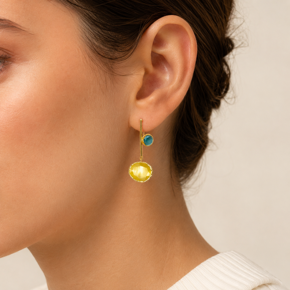Mustard yellow drop earrings with faceted round accents and gold-tone bars.