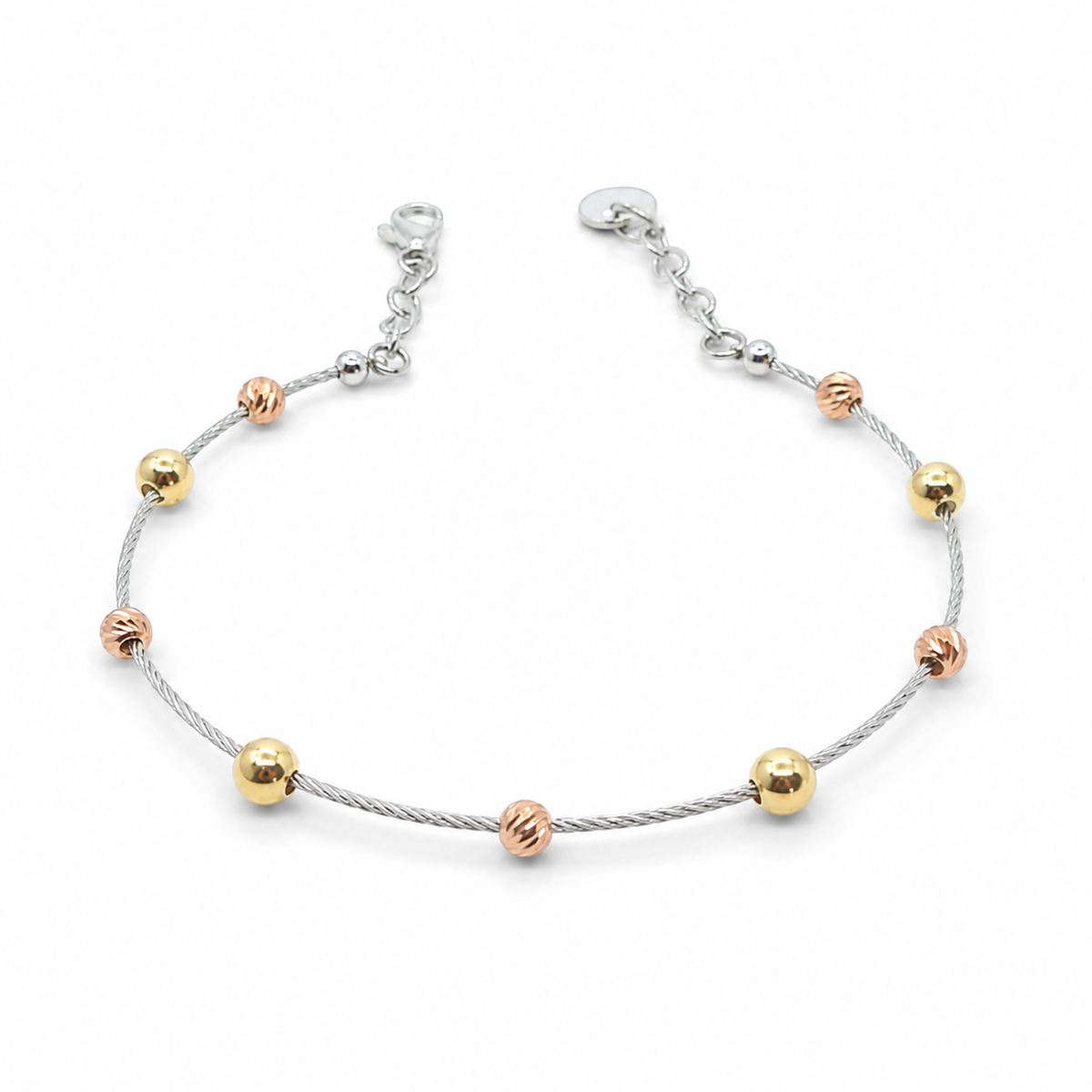 Silver bracelet with separated gold beads on a white background.