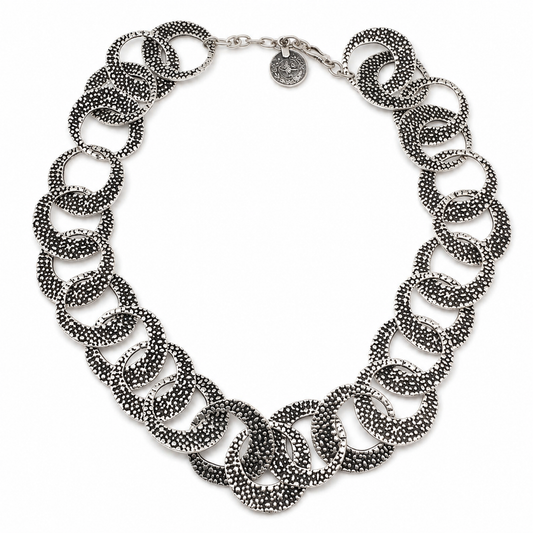 Textured silver oval link necklace with a bold layered silhouette.