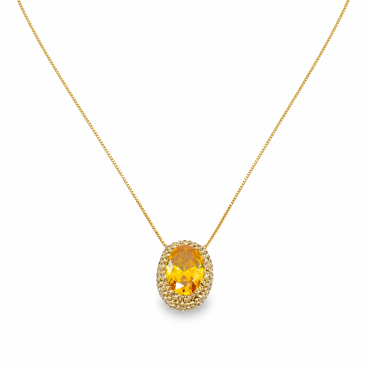 Gold-tone necklace with an oval citrine pendant on a white background.