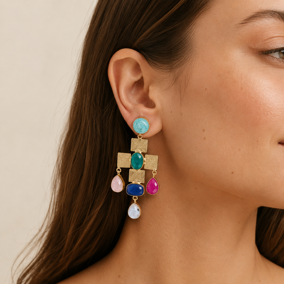 Gold-plated statement earrings with a cross-shaped mosaic design and colorful stone accents.
