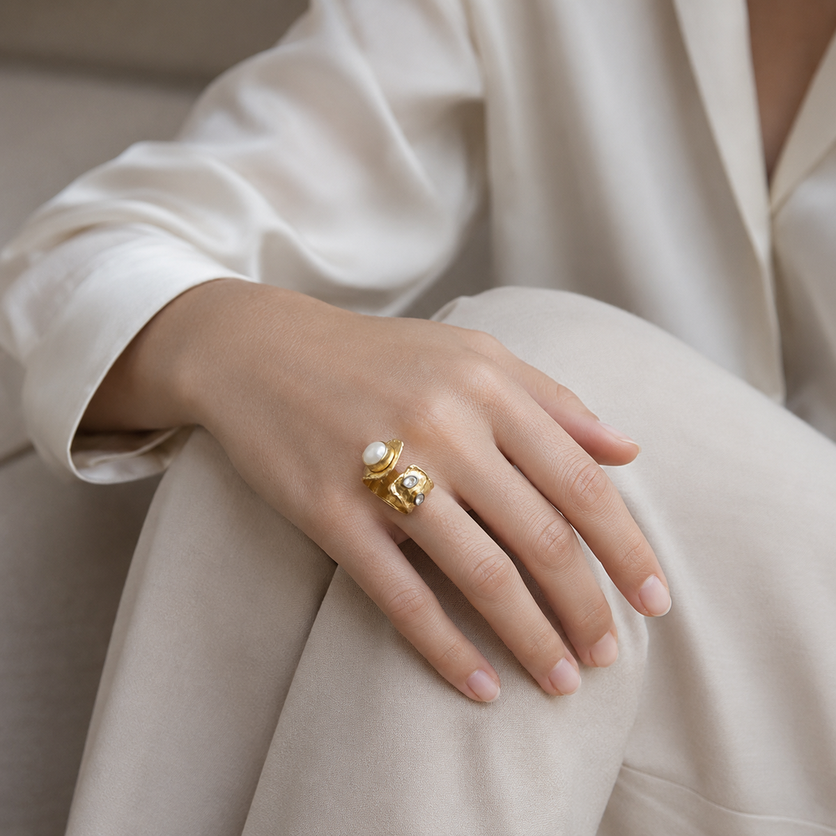 Detailed view of the ring’s open shape and clear stone accents.
