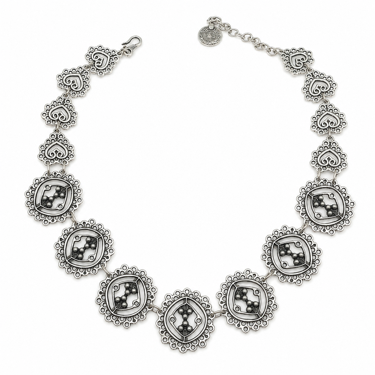 Silver-tone circle cluster link necklace with detailed round links and sculptural accents.