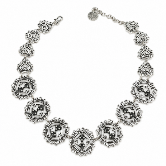 Silver-tone circle cluster link necklace with detailed round links and sculptural accents.
