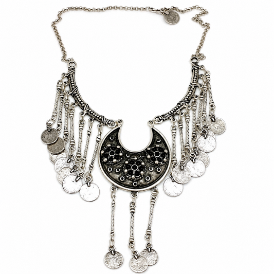 Silver-tone pendant necklace with black bead detail and chain fringe.
