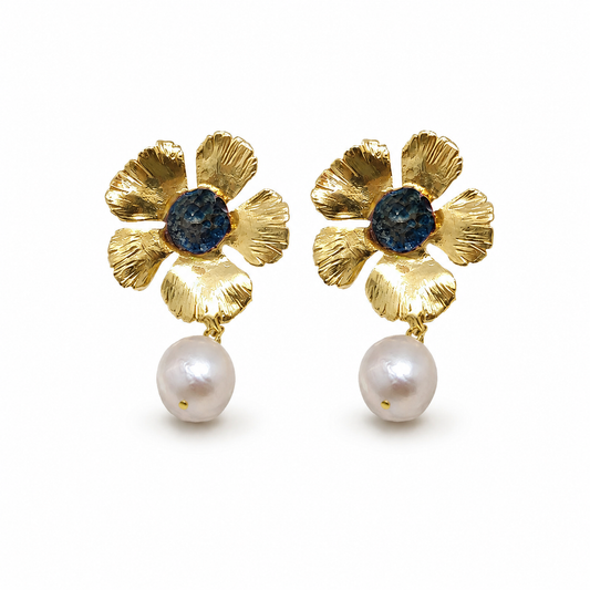 Gold flower drop earrings with a blue center and pearl drop.