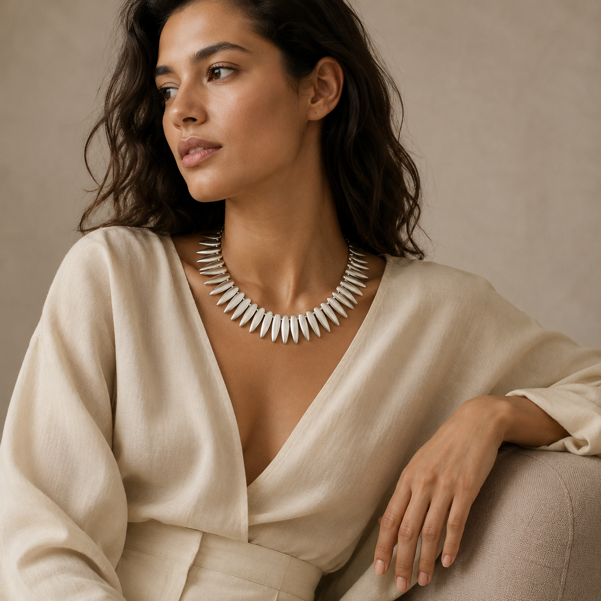 Silver-tone leaf spike necklace with a bold collar silhouette.