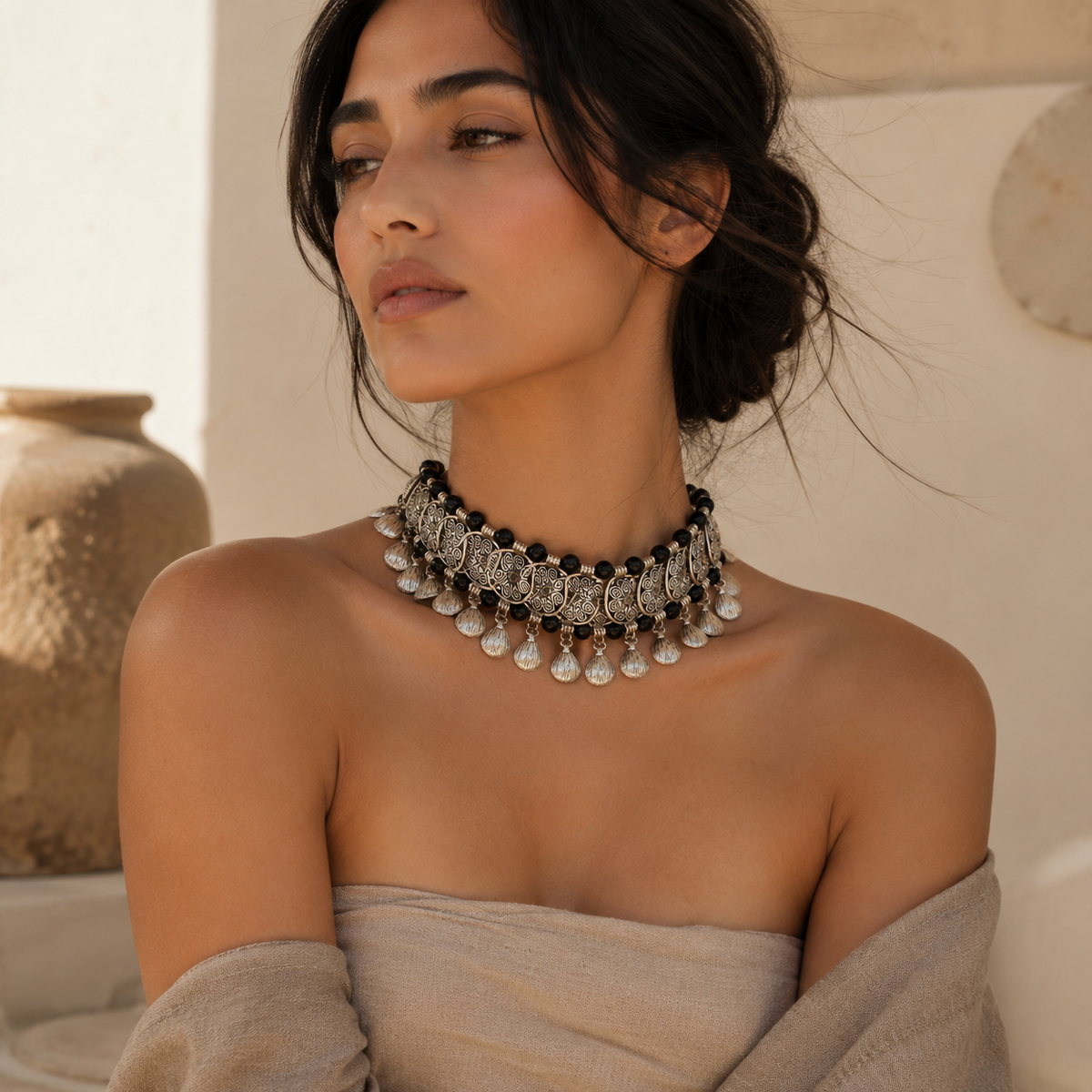 Black bead filigree coin choker necklace with a layered, textured look.