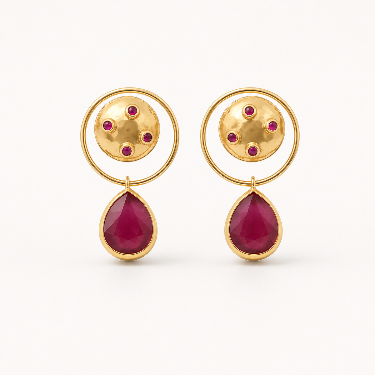 Gold-plated dangle earrings with a circular top, magenta accents, and a teardrop drop.