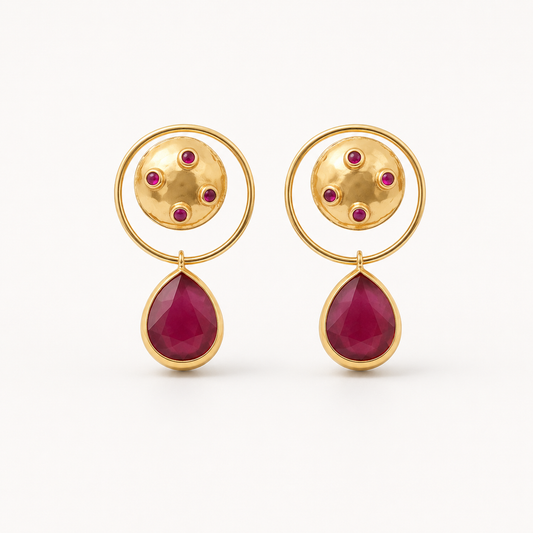Gold-plated dangle earrings with a circular top, magenta accents, and a teardrop drop.