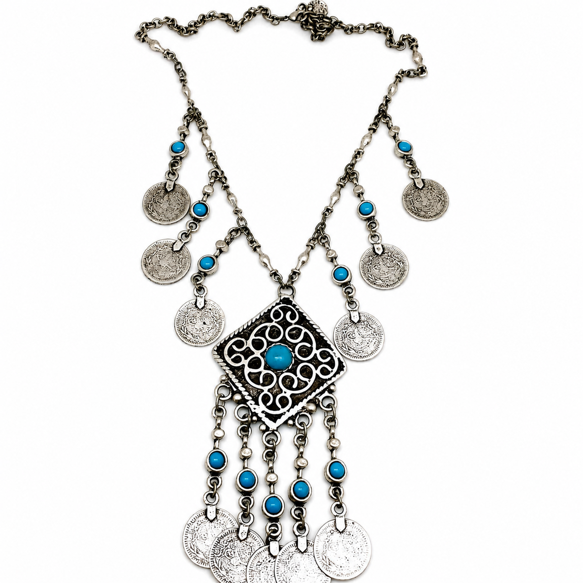 Silver necklace with turquoise accents, medallion coins, and a fringe pendant.