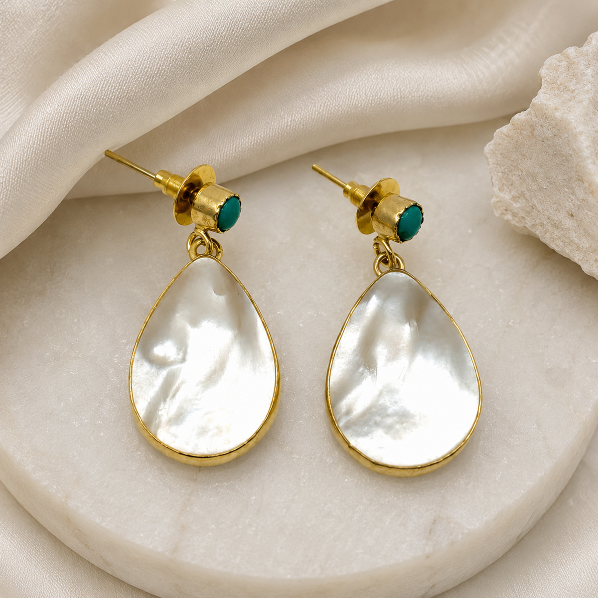 Mother of pearl and turquoise drop earrings with a gold plated finish.