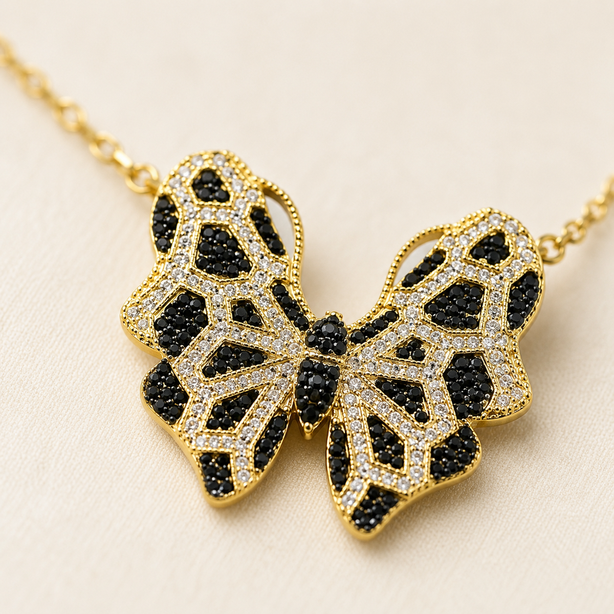 Butterfly pendant necklace with multicolor CZ accents styled on a white background.