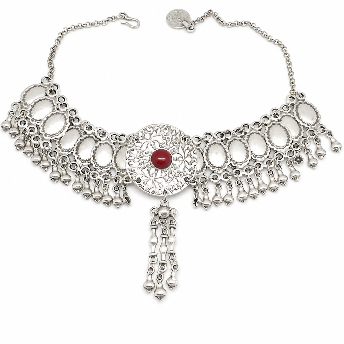 Silver-tone fringe statement necklace with a red center stone and textured disc accents.