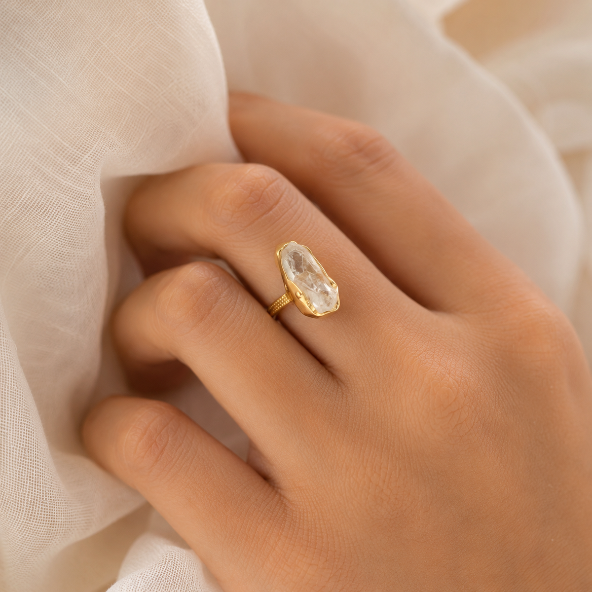 Raw clear quartz statement ring shown from the front.