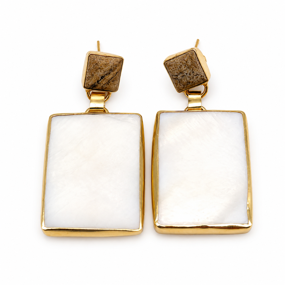 Gold-tone heart stud earrings with black onyx centers and a polished frame.