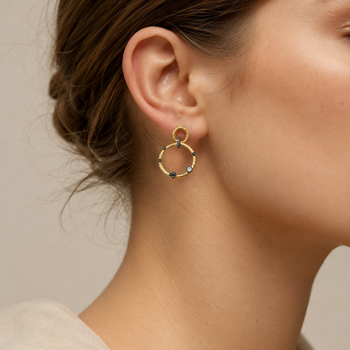 Front view of gold-plated double circle dangle earrings.