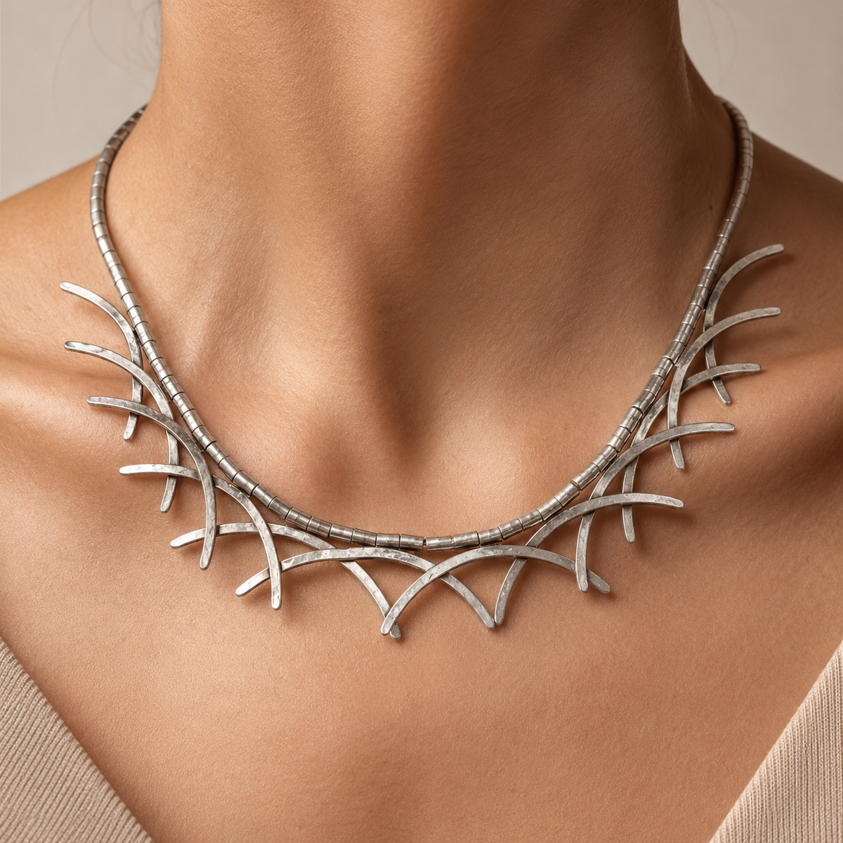 Silver-tone abstract branch collar necklace shown on a white background.