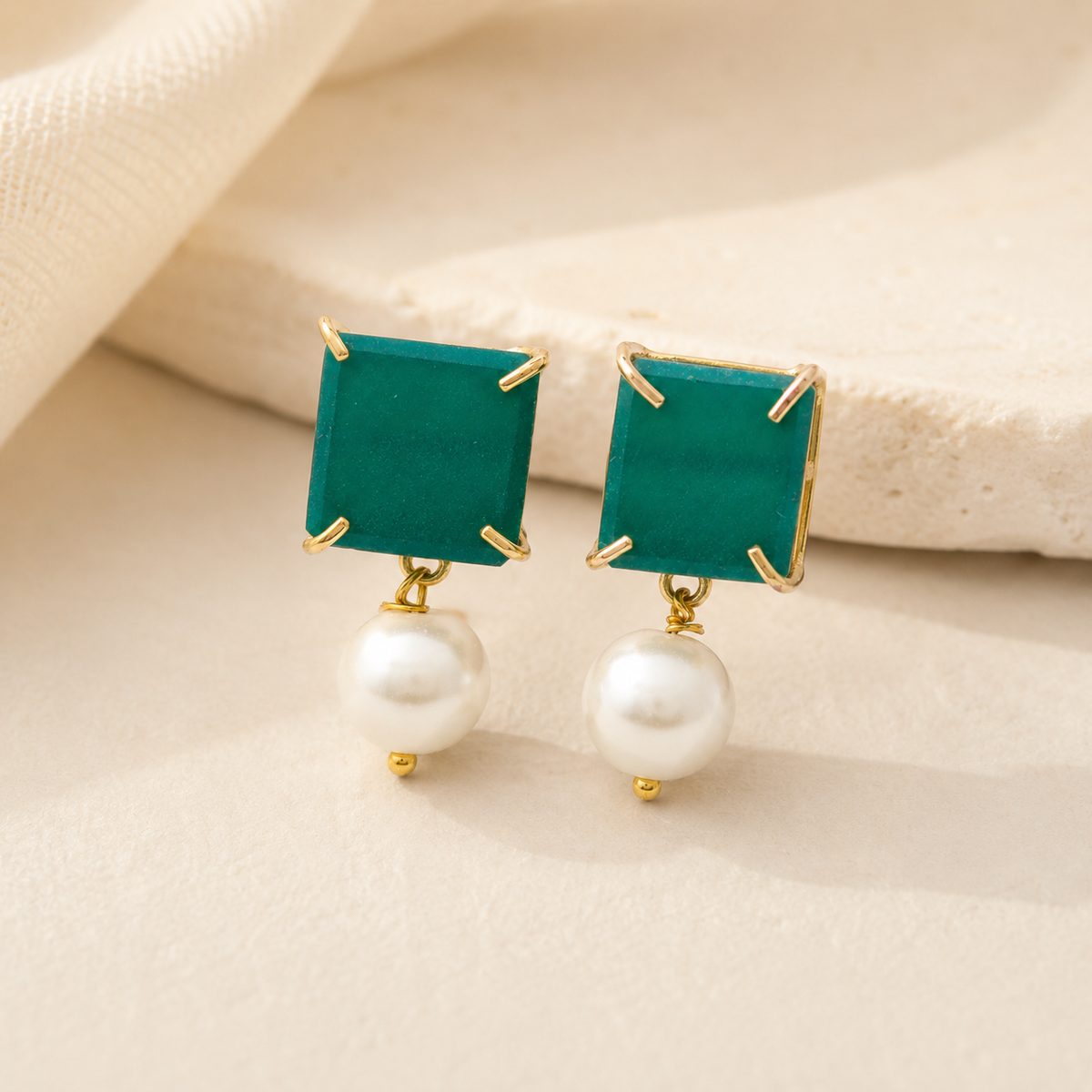 Green chalcedony and pearl drop earrings with a modern geometric shape.