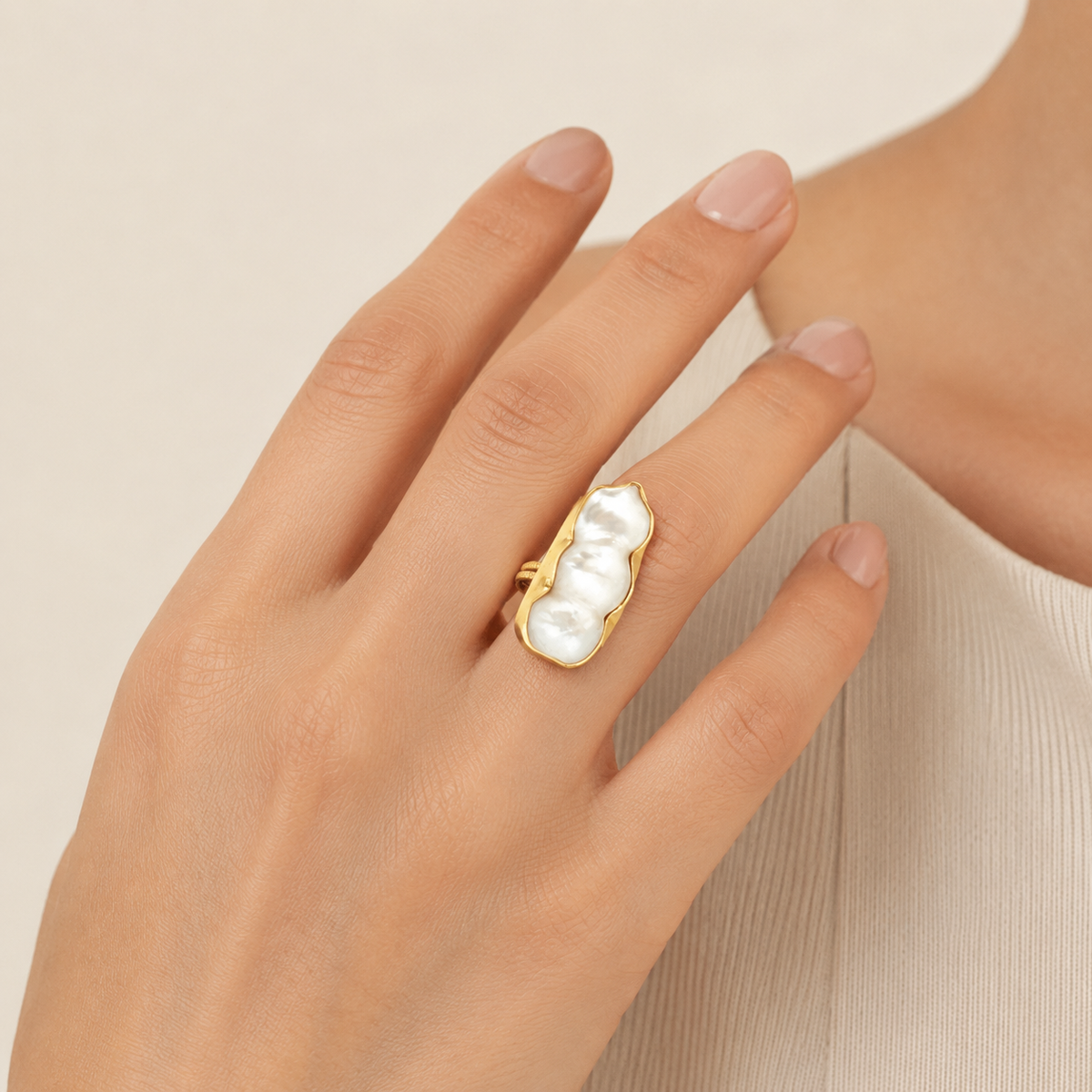 A baroque pearl statement ring shown in a gold-plated finish.