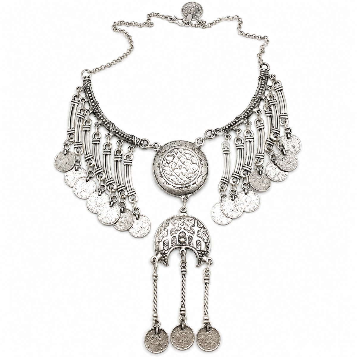 Silver-tone crescent coin fringe statement necklace with etched medallion details.